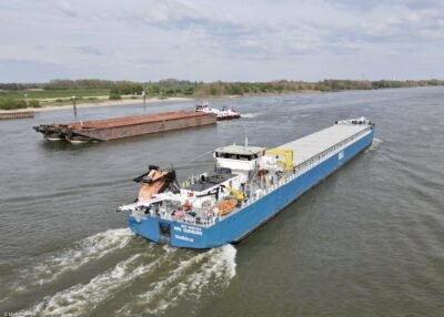 RMS Duisburg on river Rhine passing Spijk, 21-04-2022