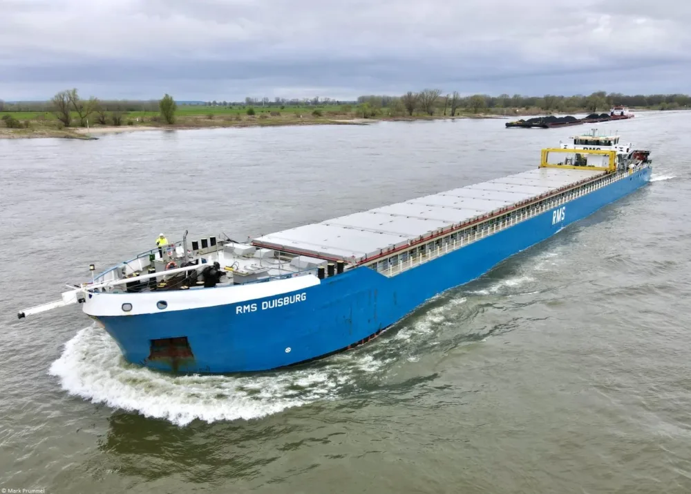 RMS Duisburg on river Rhine passing Tolkamer, 27-03-2024